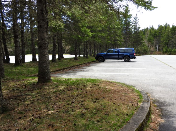 The sole vehicle in the parking lot of Bennett lake